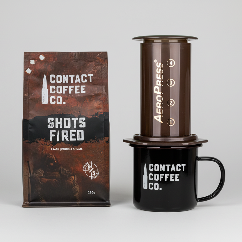 Contact Coffee Co. coffee package, AeroPress coffee maker, and black mug on a white background