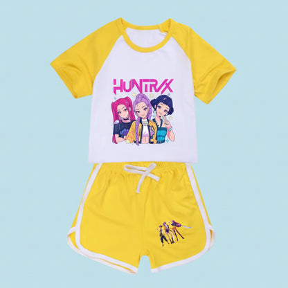 Children's outfit with yellow and white top and shorts featuring 'HUNTRX' on a white background