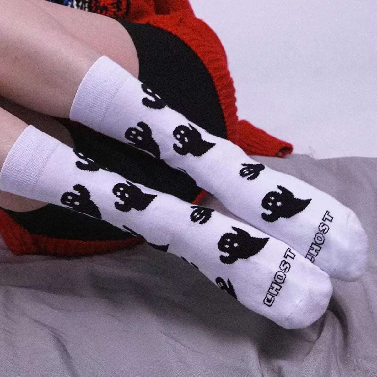 model wearing white ghost socks