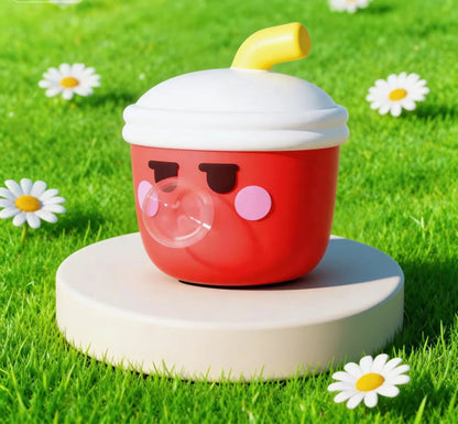 Red cup-shaped character with a white lid on a grassy background with flowers