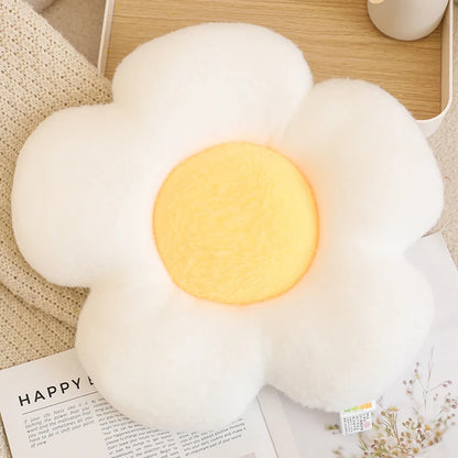 Fluffy white cloud-shaped lamp with a glowing yellow center on a wooden surface.