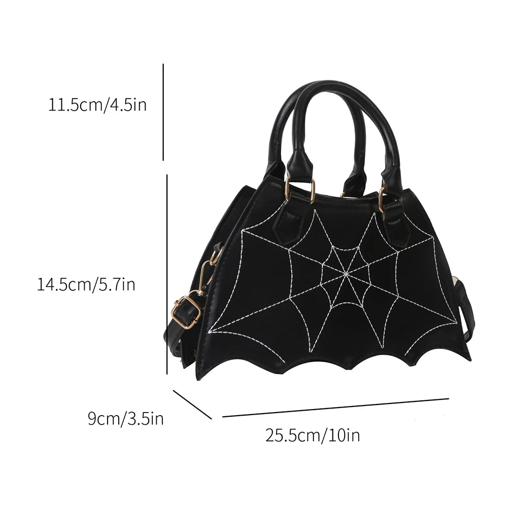 Black handbag with spider web design and measurements on a white background