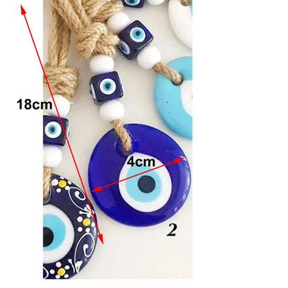 Evil eye beads with measurements on a white background