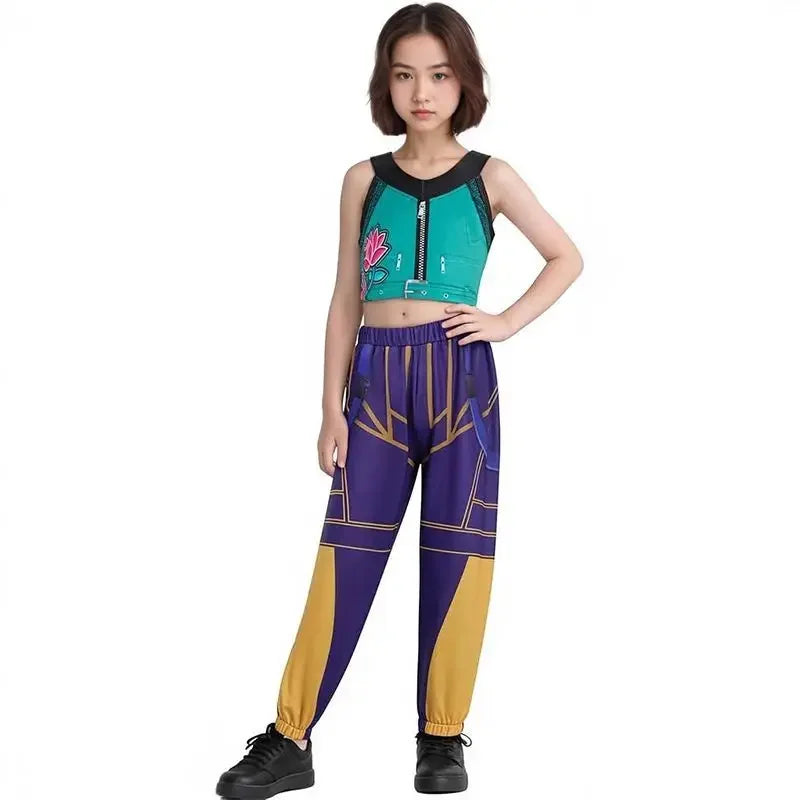 A young woman modeling a matching athletic outfit consisting of a sleeveless crop top and jogger pants with a purple, teal, and gold geometric pattern, set against a plain white background.
