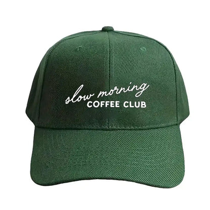 Green cap with 'slow morning COFFEE CLUB' text on a white background