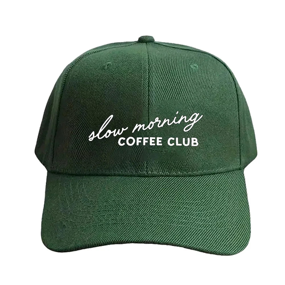 Green cap with 'slow morning COFFEE CLUB' text on a white background