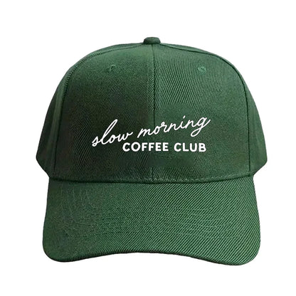 Green cap with 'slow morning COFFEE CLUB' text on a white background