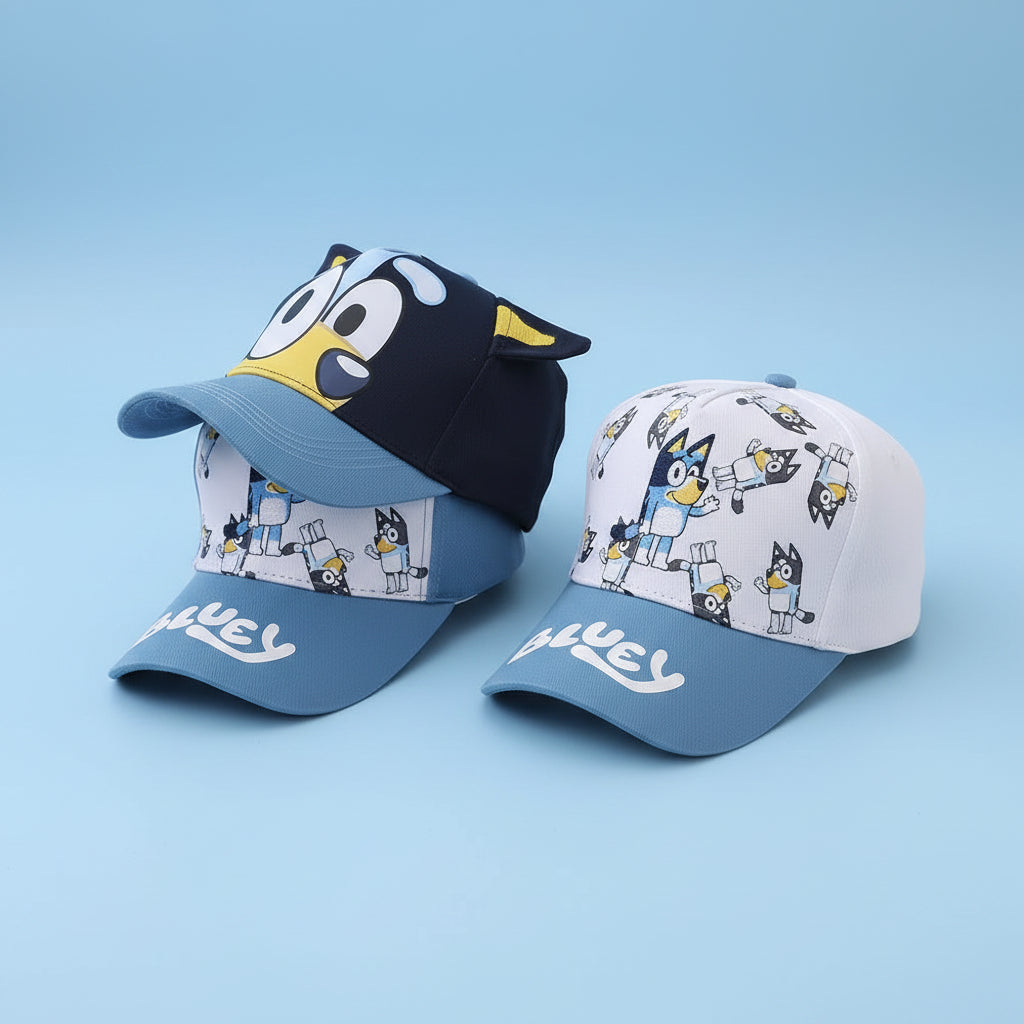Two children's baseball caps with cartoon character design on a white surface.