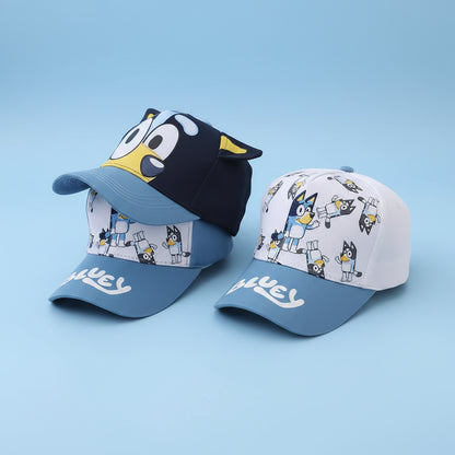 Two children's baseball caps with cartoon character design on a white surface.