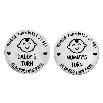 Two round metal tokens with humorous text and baby face design on a white background.