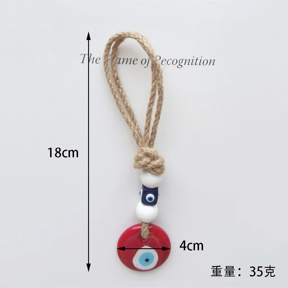 Measurement chart of a decorative keychain with beads and rope on a light gray background