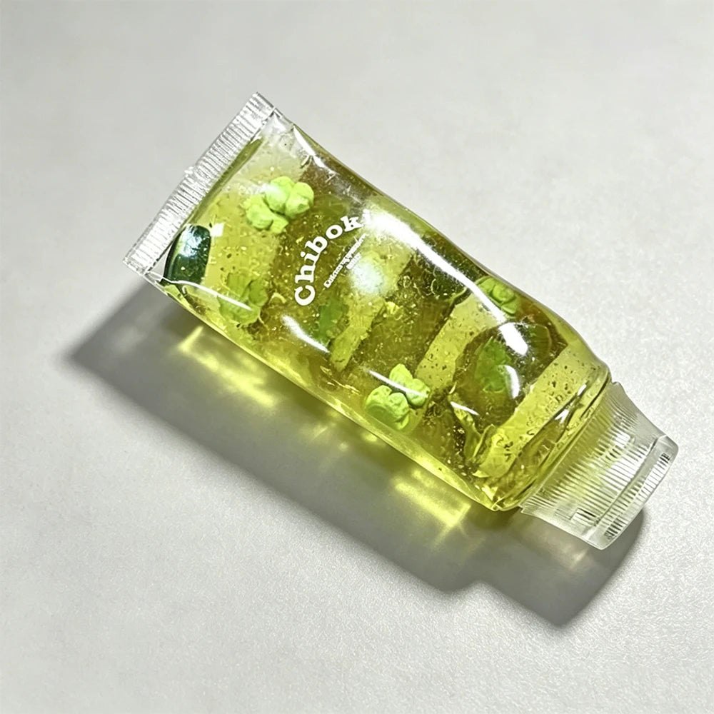Green skincare product with 'Chiboki' branding on a light gray background