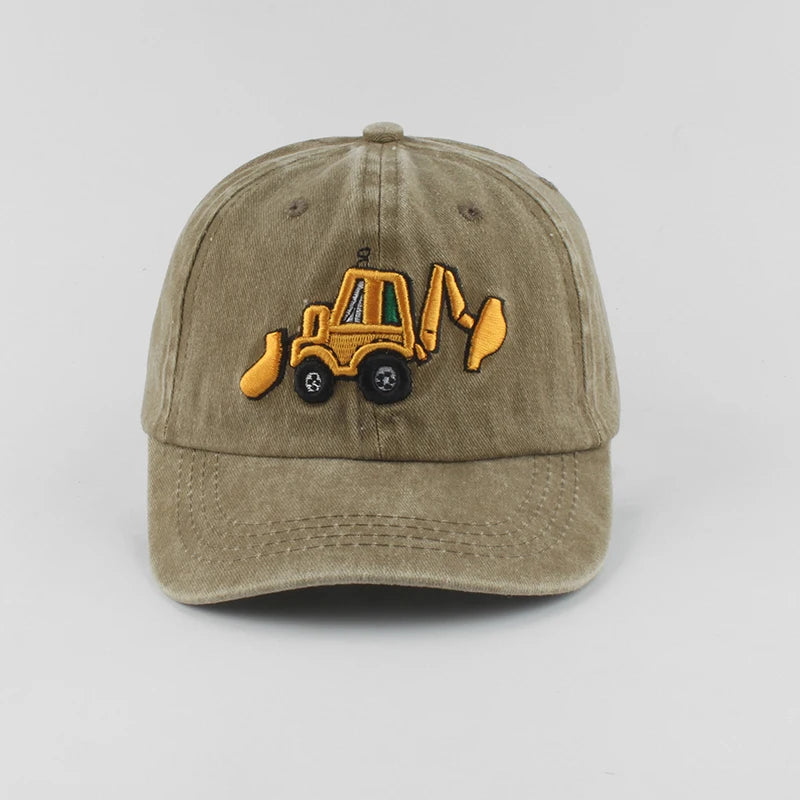 Khaki cap with a yellow bulldozer emblem on a light gray background