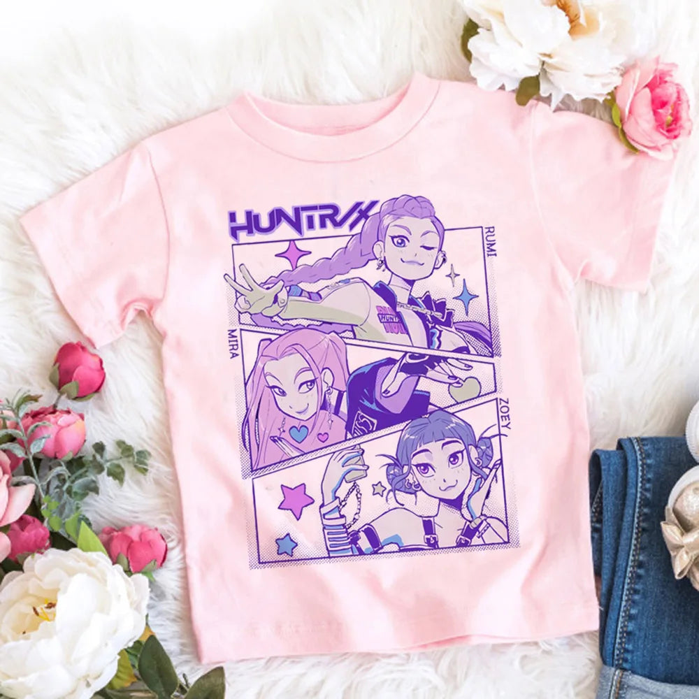 Pink t-shirt with character design on a white surface with flowers