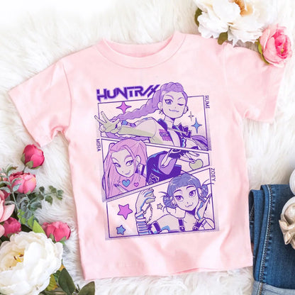 Pink t-shirt with character design on a white surface with flowers