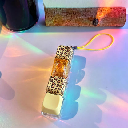 Handheld device with leopard print design on a colorful background