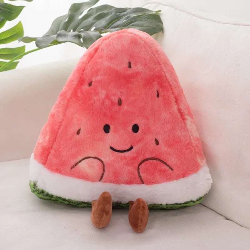 Plush toy shaped like a watermelon with a smiling face on a light-colored surface.