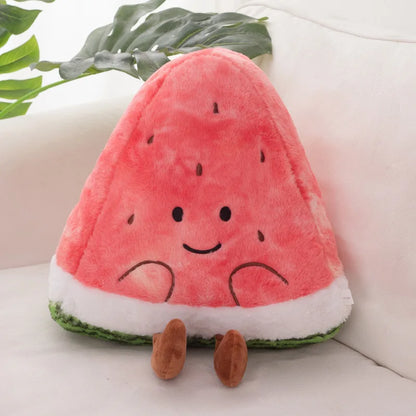 Plush toy shaped like a watermelon with a smiling face on a light-colored surface.