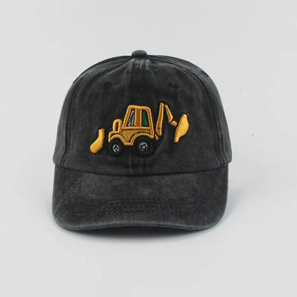 Black cap with yellow bulldozer design on a light gray background