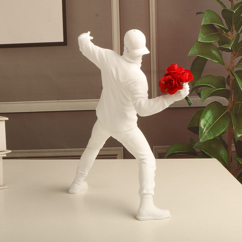Banksy flower thrower statue from behind