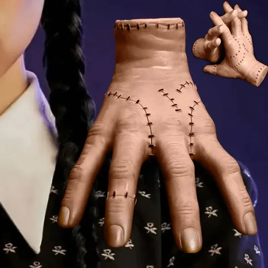 Close-up of a hand with detailed stitching on a dark background