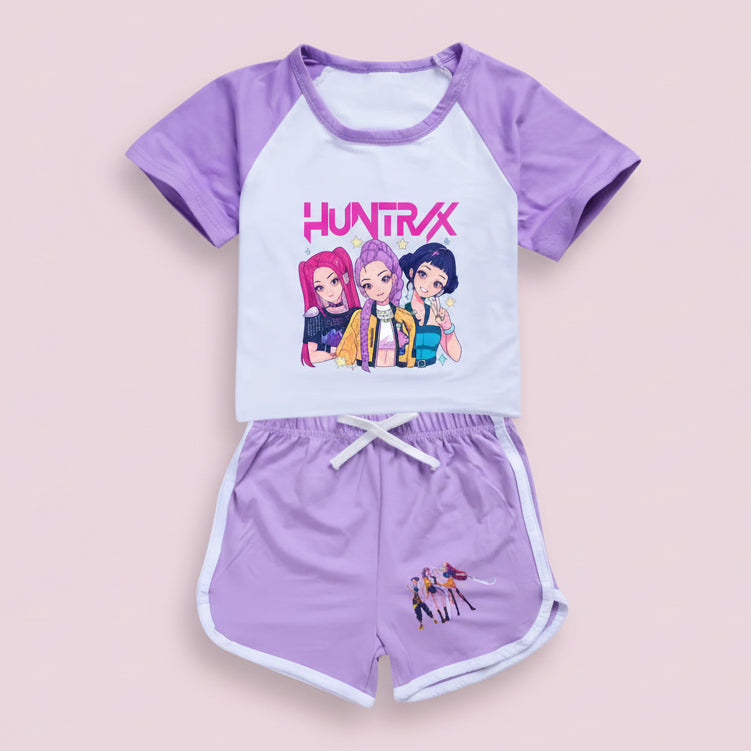 Children's outfit with a white shirt and purple shorts featuring cartoon characters and 'HUNTRAX' text.