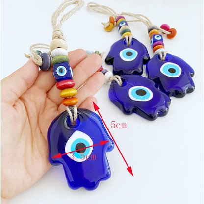 Blue evil eye charms with colorful beads on a white background