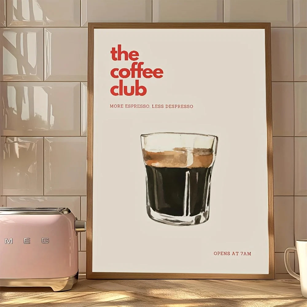 Framed poster of a coffee glass with 'the coffee club' text in a kitchen setting.