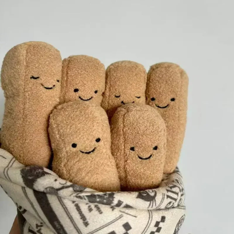 Set of plush bread toys with smiling faces on a light gray background