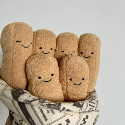 Set of plush bread toys with smiling faces on a light gray background