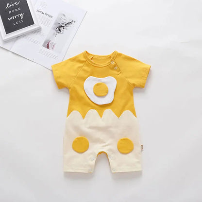 Yellow and white baby romper with cartoon design on a light gray background