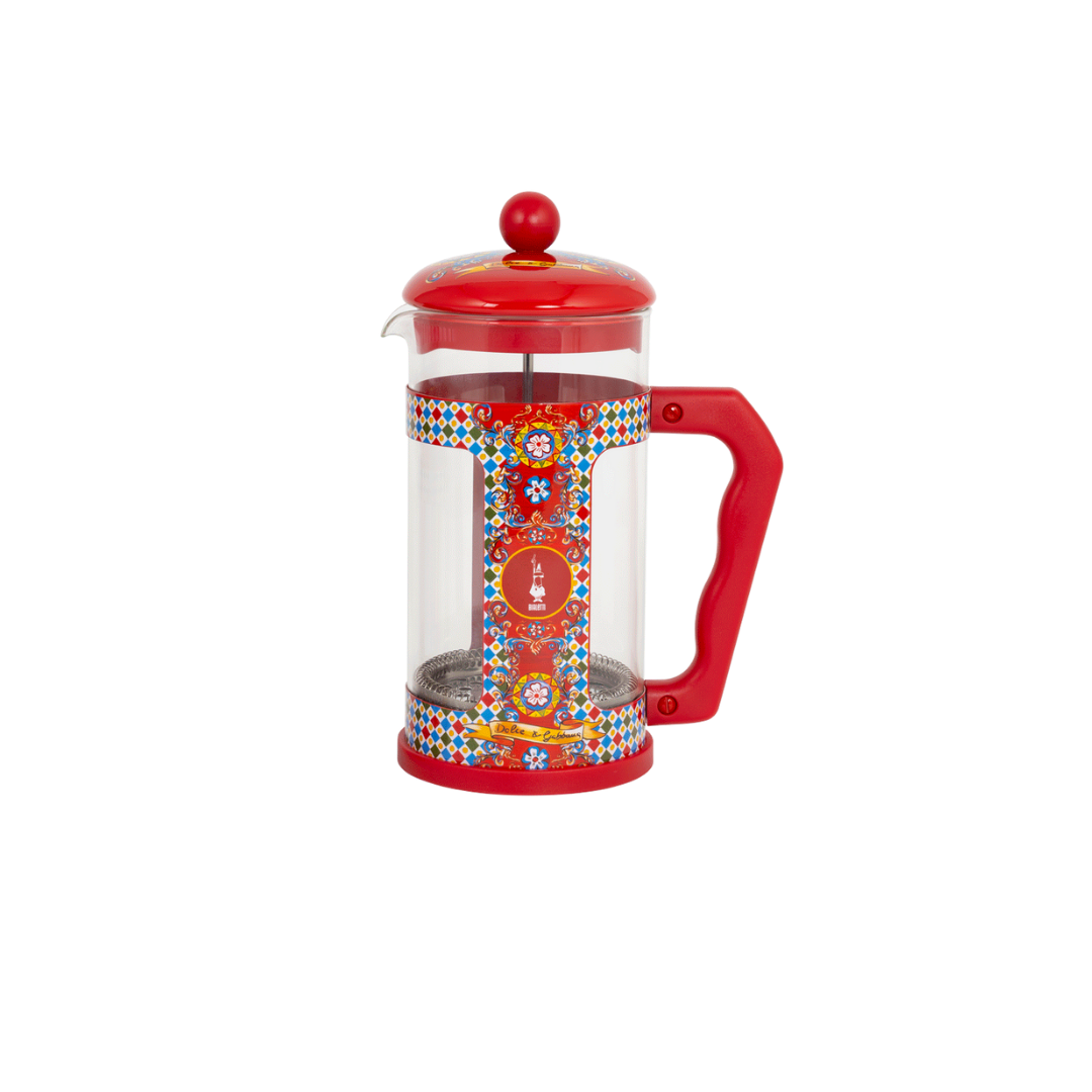 Red French press coffee maker with colorful design on a white background