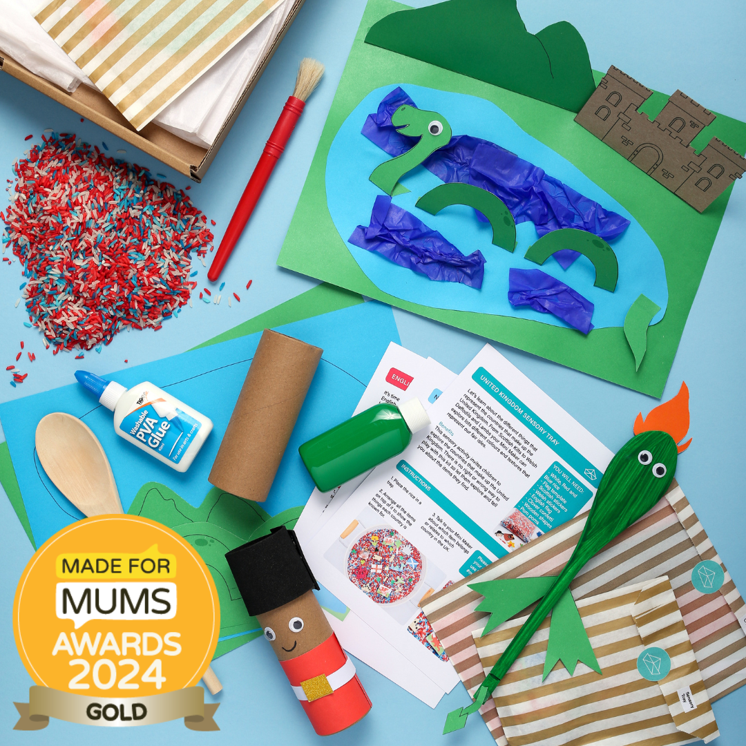 Crafting materials and child's artwork on a blue surface with 'Made for Mums Awards 2024 Gold' badge.