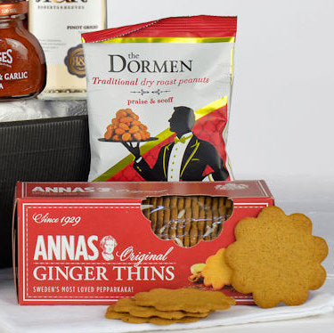 Packaging of Annas Original Ginger Thins and Dormen peanuts on a white surface.