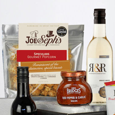 Assorted food products including Joe & Seph's popcorn, R&R wine, and Red Pepper & Garlic Salsa on a white background.