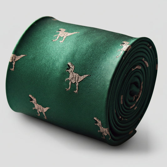 Green tie with dinosaur pattern rolled up on a white background