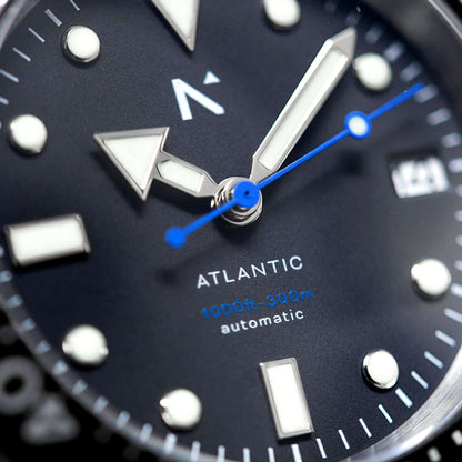 Close-up of an Atlantic watch face with blue second hand