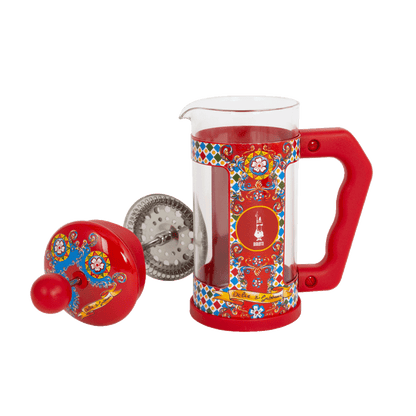 Red cafetiere with colorful patterns on a transparent background