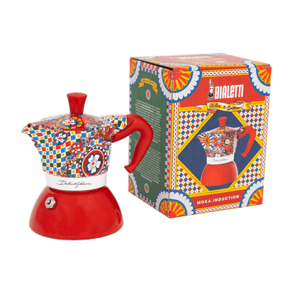 Colorful Moka pot with decorative pattern next to its box on a transparent background