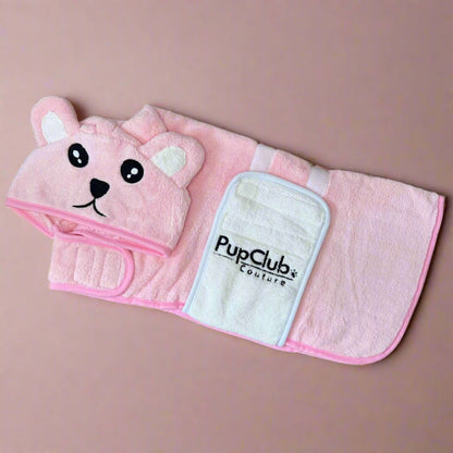 Pink towel with bear ears and face on a beige background, featuring the PupClub Couture logo.