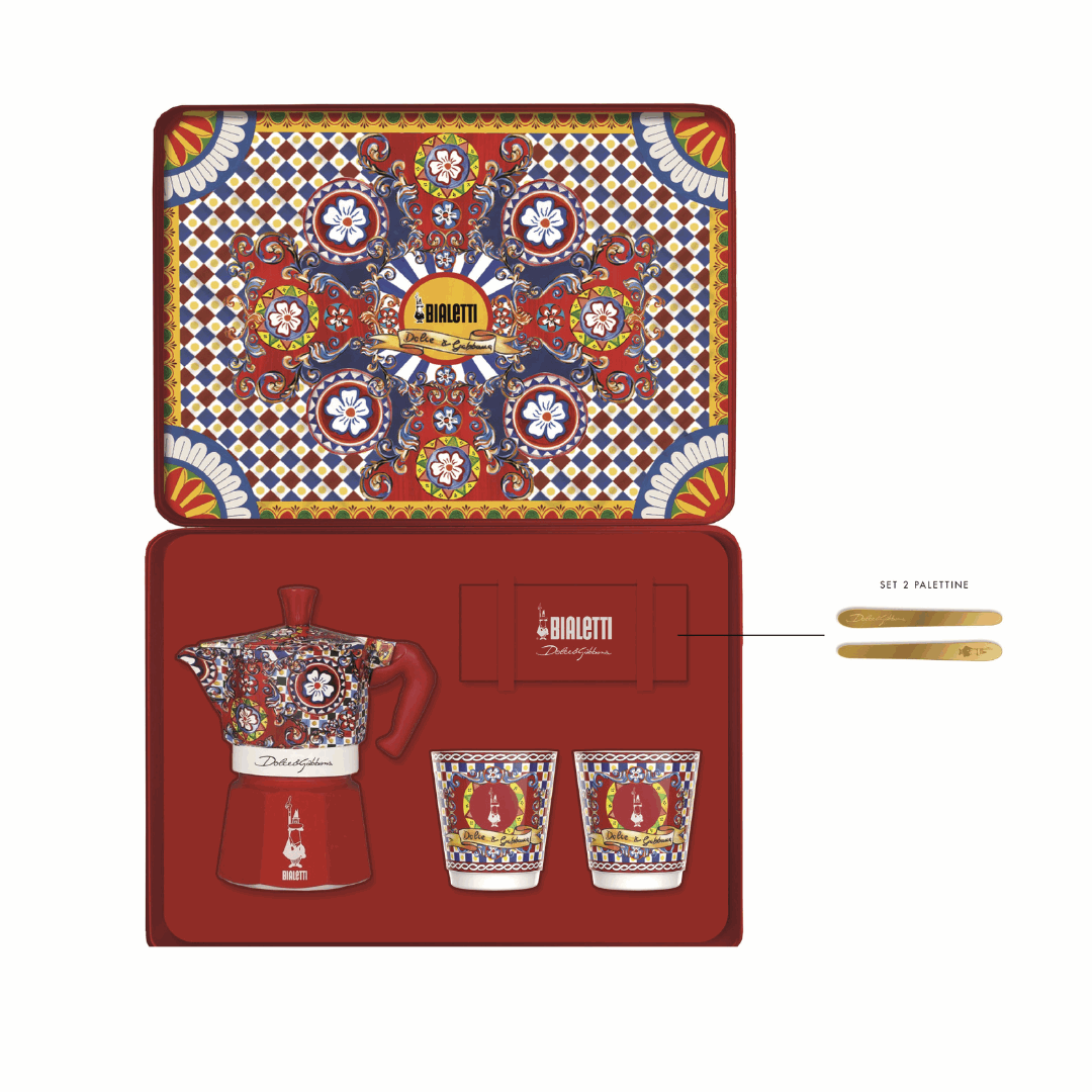 Bialetti coffee maker set with decorative lid and packaging on a white background