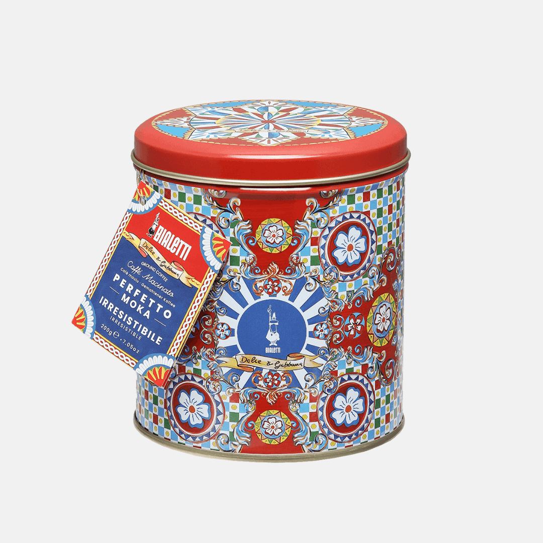 Decorative tin can with colorful patterns and a label on a white background