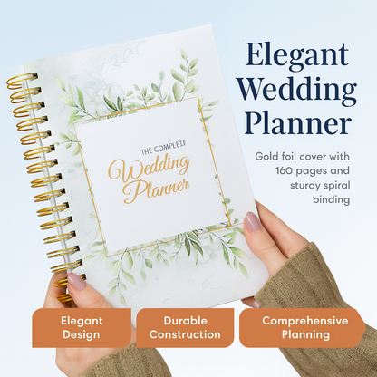 Elegant wedding planner with gold foil cover and greenery design, held by a person.