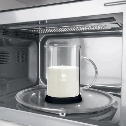 Glass container with a candle inside a microwave oven
