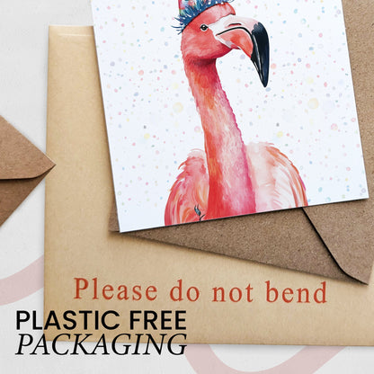 Card with a flamingo design on a brown envelope, with text 'Please do not bend' and 'Plastic Free Packaging'.