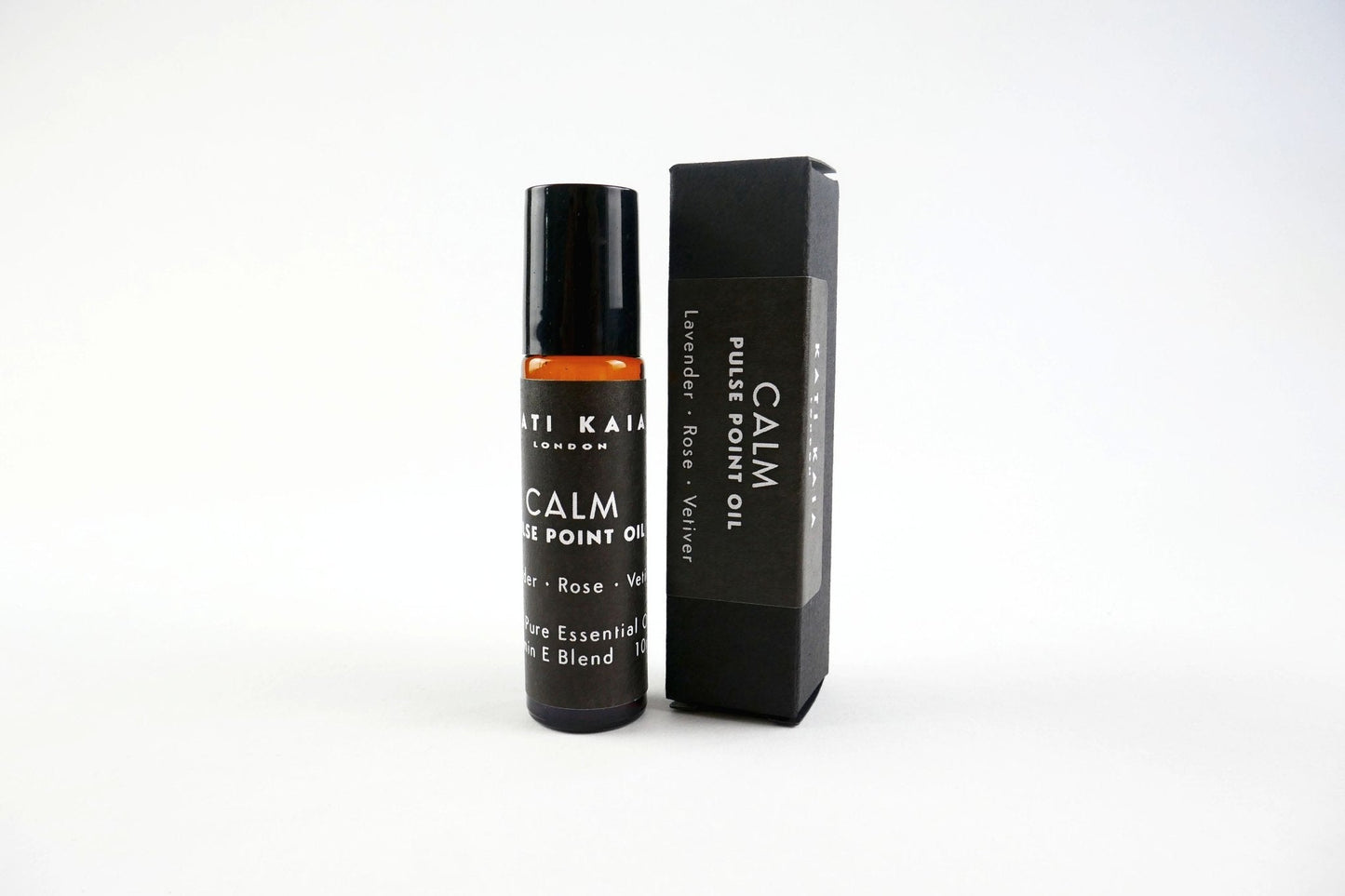 Roll-on bottle and packaging of 'Calm' essential oil on a white background