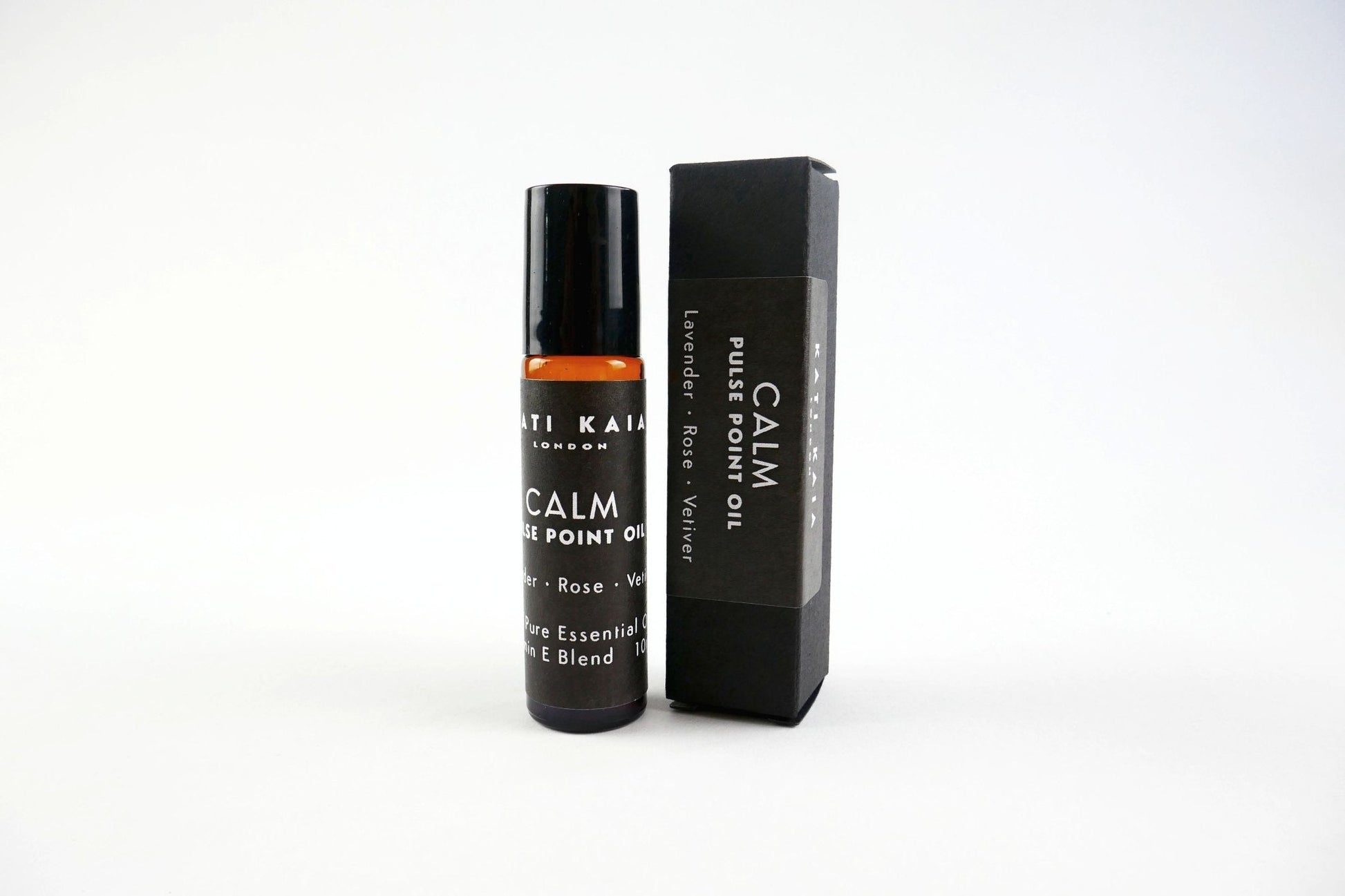 Roll-on bottle and packaging of 'Calm' essential oil on a white background