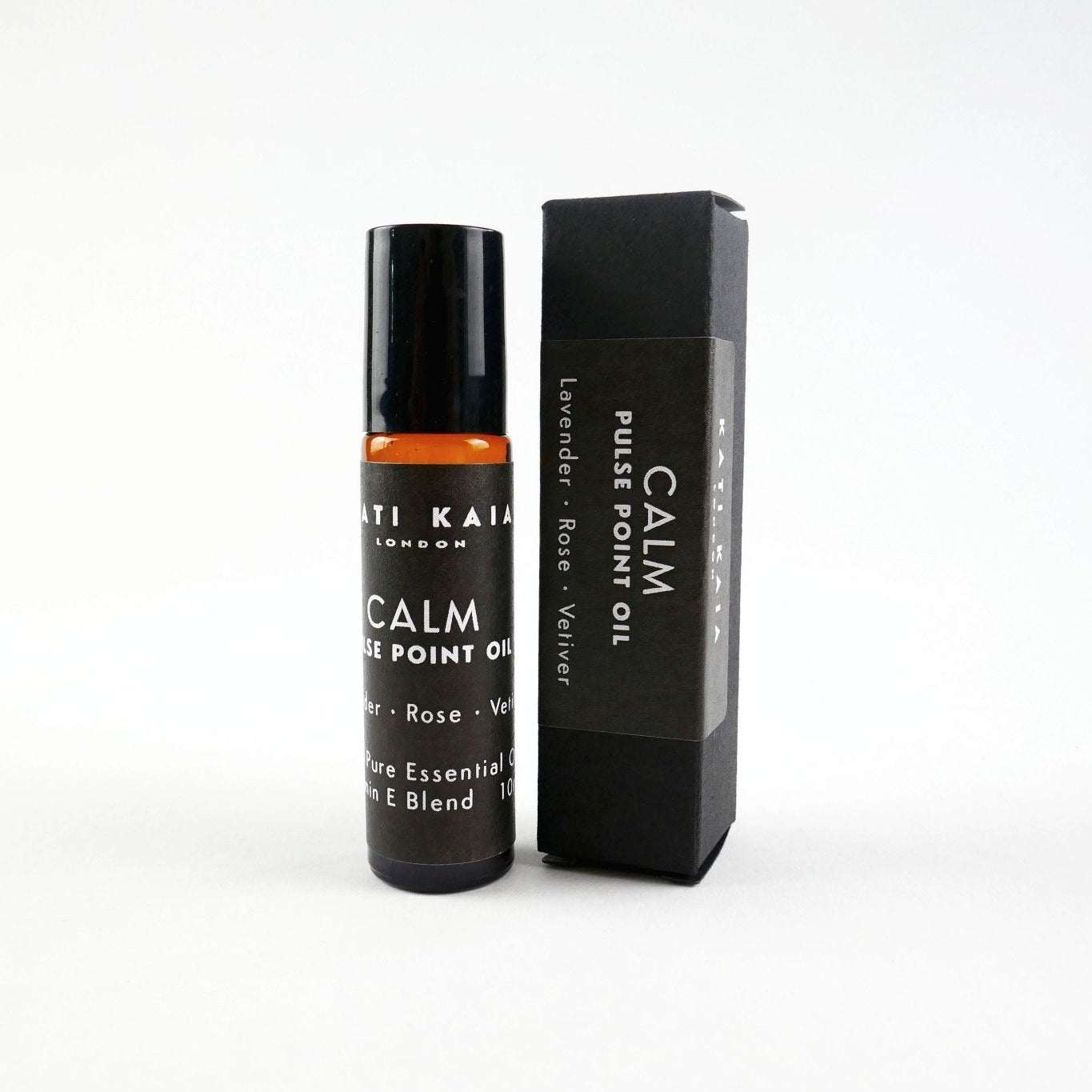 Roll-on bottle and packaging of 'Calm' essential oil on a white background