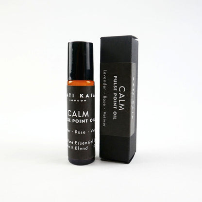 Roll-on bottle and packaging of 'Calm' essential oil on a white background