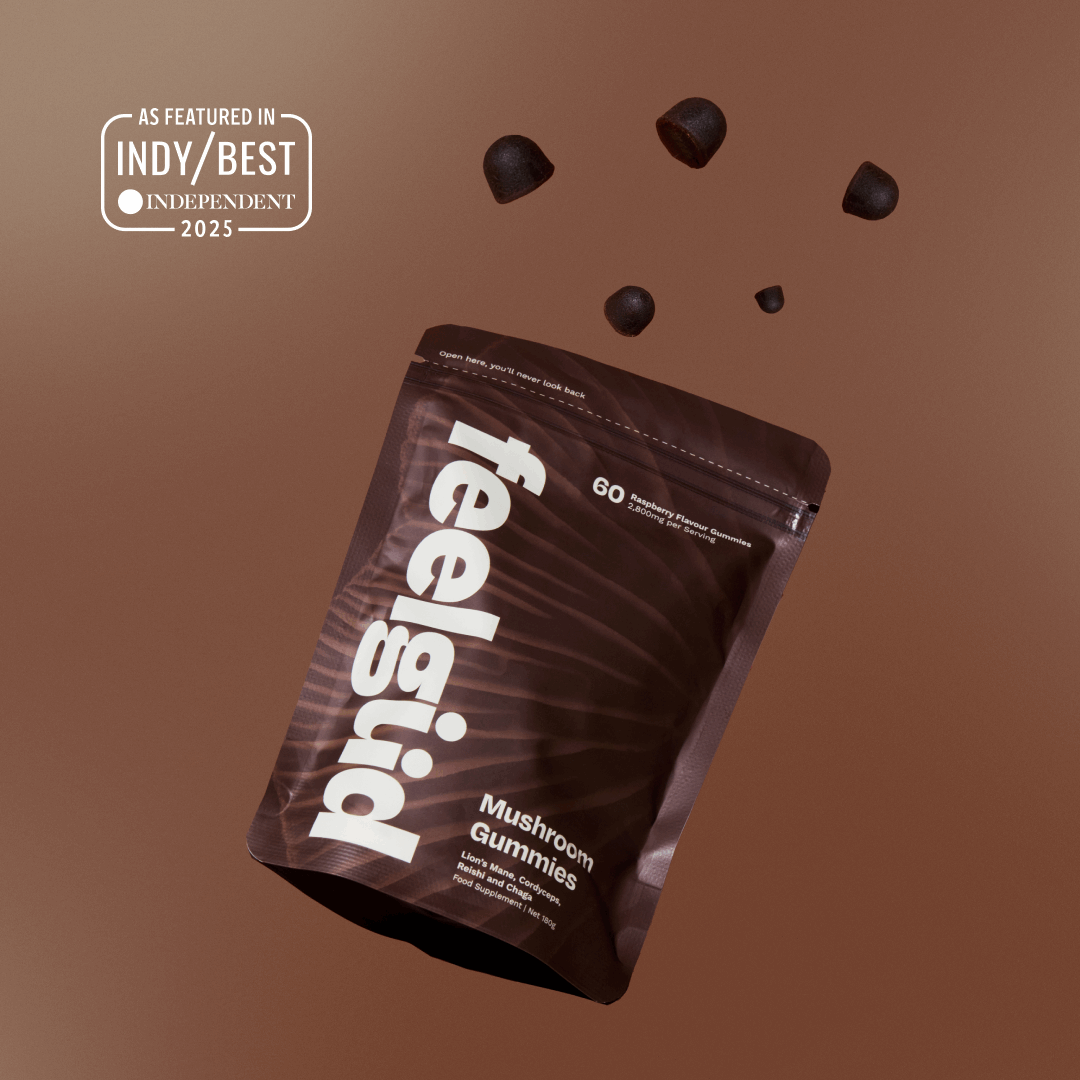 Feelgood Mushroom Gummies packaging with gummies floating above on a brown background